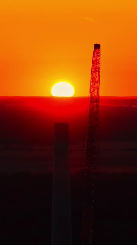 Drone Hovering Near Industrial Crane during brilliant sunset Stock Footage 336801669