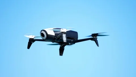 Drone hovering or flying against clear blue sky Video stock 89733201