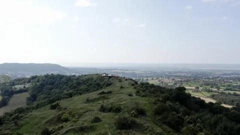 Drone hovering over mountain ridge in rural landscape with green hills and .. Stock Footage 337815479