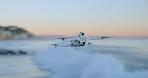 Drone Hovering Over Ocean Waves at Beach at Sunset. Slow Motion, Close Up Stock Footage 343928318