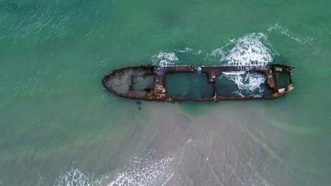 Drone hovering over old rusty shipwreck at the coast in Denmark Video stock 283072763