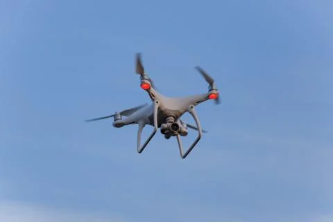 The drone, hovering in the sky. Flight quadrocopters Stock Photos