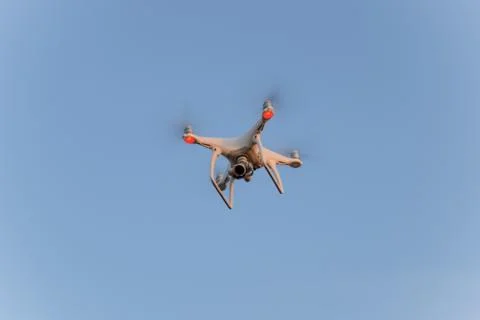 The drone, hovering in the sky. Flight quadrocopters Stock Photos