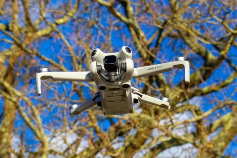 Drone hovering in the sky Stock Photos