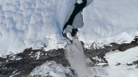 Drone Hovering at Top of Snowy Waterfall in Iceland in 4K Stock Footage 89439772