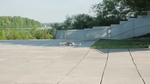 Drone Hovers Above The Ground Stock Footage 138954369
