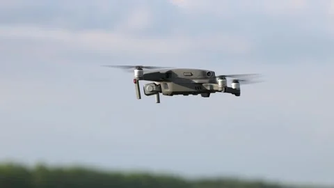 Drone hovers against a blue sky background Stock Footage 336743358