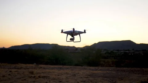 Drone Hovers And Flies Left Out Of Frame At Dusk Video stock 115044762