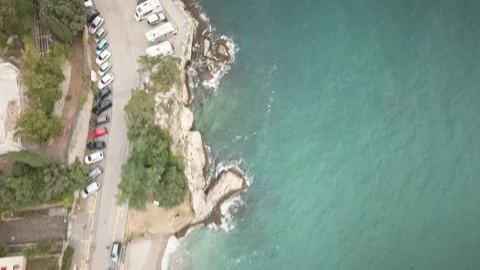 Drone hovers forward over Trieste shoreline and turquoise sea 4K Stock-Footage 331097535
