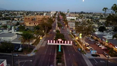 Drone hovers in front of The Boulevard neon sign as full moon rises Stock Footage 97159798
