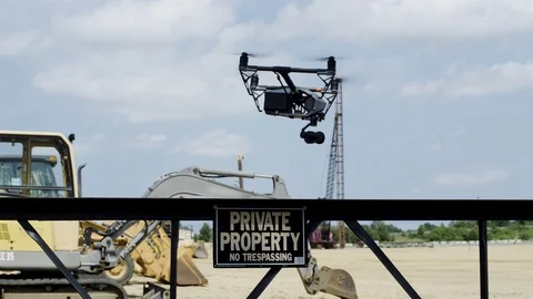 Drone hovers in front of private property sign-exits over camera Stock Footage 80133447