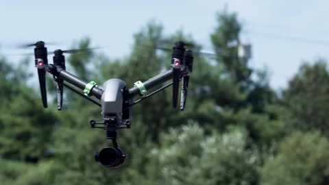Drone hovers in front of trees Stock Footage 80151724