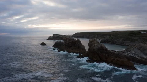 Drone Hyperlapse 4K. Rocks and sea dancing together with beautiful light. Spain Stock Footage 135340212