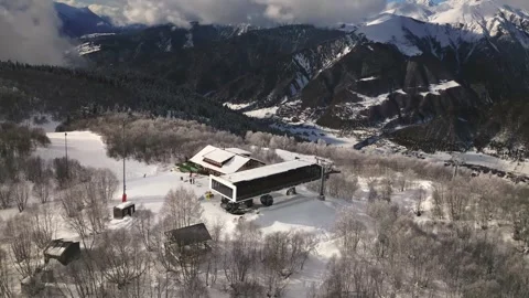 Drone hyperlapse capturing skiers and alpine resort infrastructure on snowy.. Stock-Footage 324968746