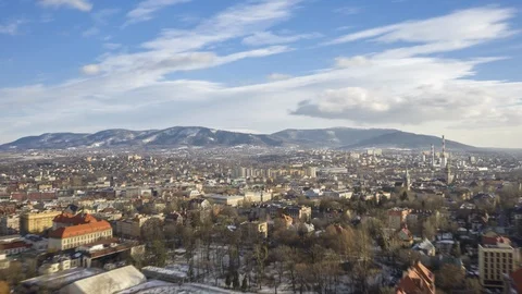 Drone Hyperlapse - City with Mountains and Clouds Stock Footage 101727006