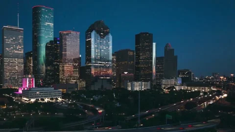 Drone Hyperlapse of Downtown Houston Skyline and Highway Traffic at Blue Hour Vídeo Stock 346244407