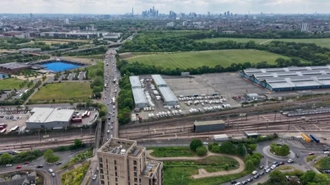 Drone hyperlapse over Eastway and New Spitalfields Market toward A12 and City Stock Footage 334817764