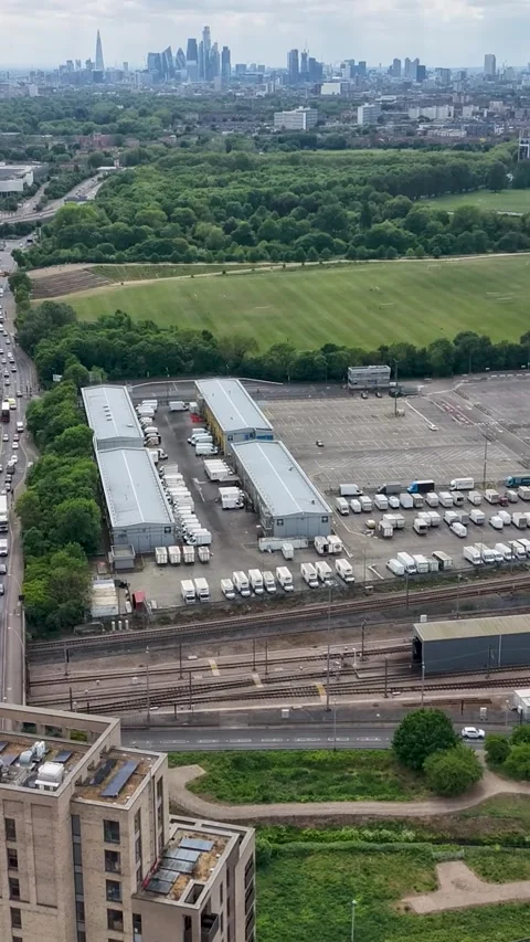 Drone hyperlapse over Eastway and New Spitalfields Market toward A12 and City Stock Footage 335456184