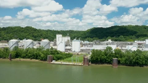 Drone hyperlapse of power plant and passing boat on the Ohio river Stock Footage 147900193