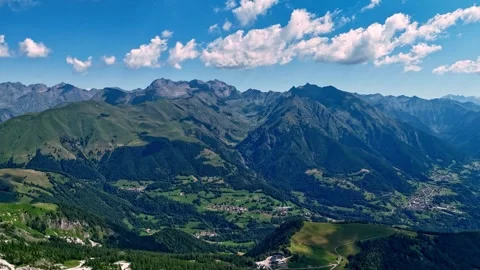 Drone hyperlapse showing fast-moving clouds over mountain peaks and ridges in Stock Footage 342275537