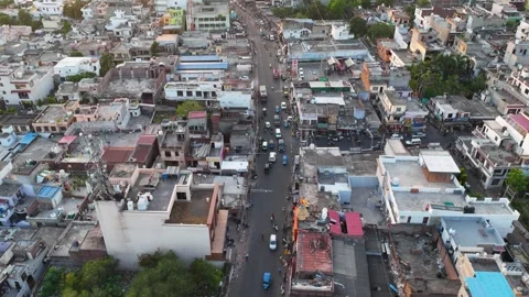 Drone Hyperlapse of Traffic moving through Densly populated Indian city Stock Footage 335989317