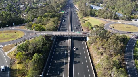 Drone hyperlapse of vehicle movement at Pacific Motorway interchange south Stock Footage 262536002