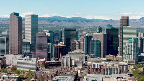 Drone hyperlapse view of Denver skyline with mountain background, Stock Footage 335001032