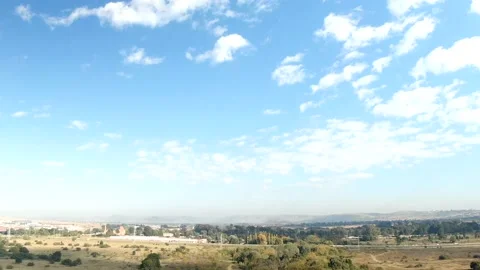 Drone hyperlapse of whispy clouds and shadows on an early morning Video stock 239167857