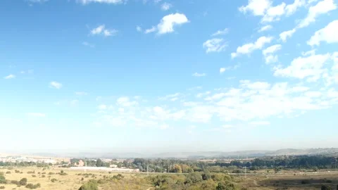 Drone hyperlapse of whispy clouds and shadows on an early morning Video stock 239379012