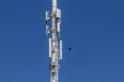 Drone Inspecting lower right of a cell tower Stock Photos