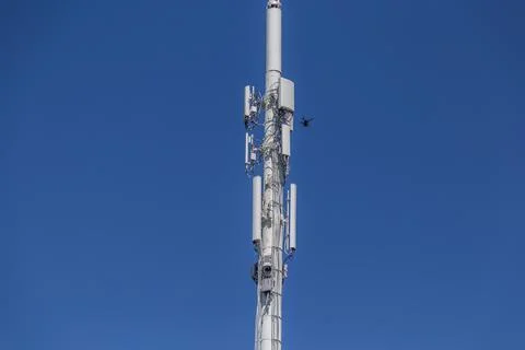 Drone Inspecting upper right of a cell tower Stock Photos