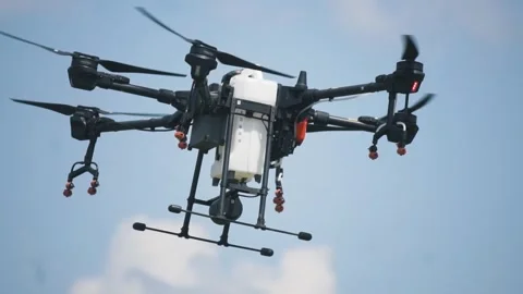 Drone for irrigation on the farm field Stock Footage 255621072