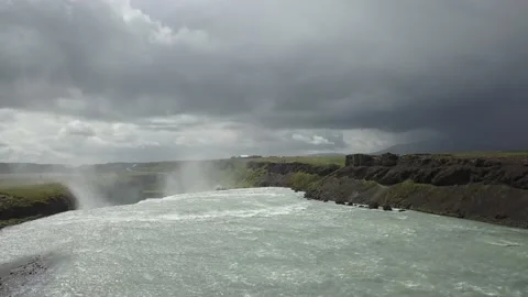 Drone jibs up from top of waterfall Stock-Footage 166869893