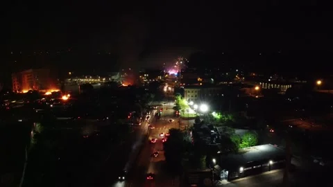 Drone landing after a flight over a dangerous riot zone in big American city Stock Footage 134506044