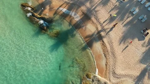 A drone lands on a sandy beach on Koh Samui, Thailand. View top down on the Video stock 141296655