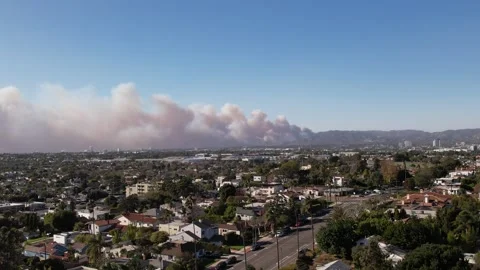 Drone of Large Cloud of Smoke from burning Palisades Fire above Santa Monica Stock Footage 302693045