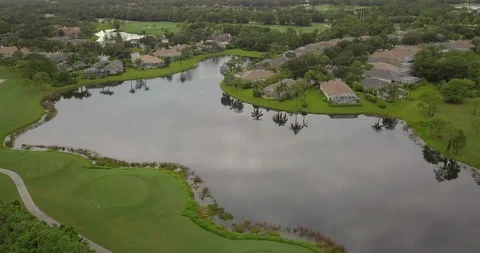Drone of large lake in Florida surrounded by housing Stock Footage 94861190