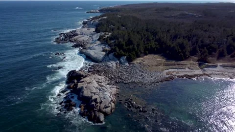 Drone of Large Waves Crashing into Rocks on Shore in Nova Scotia Stock Footage 192777963