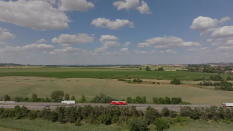 Drone lateral movement over Germany autobahn with daytime traffic Stock Footage 264188362