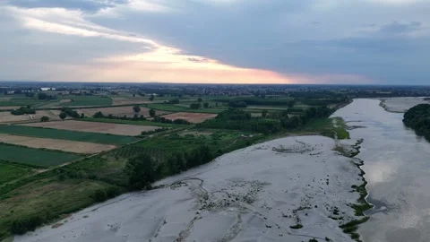 Drone lateral slide above drought-affected Po River with exposed sandbars in Stock Footage 340604155