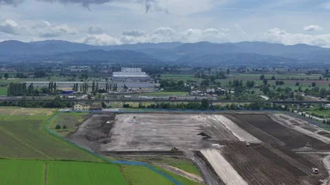 Drone lateral slide above logistics park construction and A1 freight corridor Stock Footage 336257301