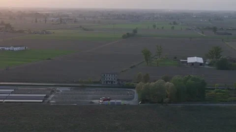 Drone lateral slide above solar farm construction along SS9 Via Emilia in the Vídeo Stock 340604351