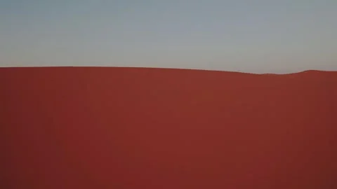 Drone lateral slide along towering Erg Chebbi dune near Merzouga Morocco at Stock Footage 337978186