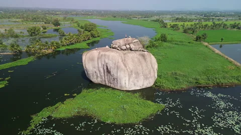 Drone Lateral Tracking Shot of Inselberg in lake, Phu Dien Southern Vietnam 库存影片 329914747