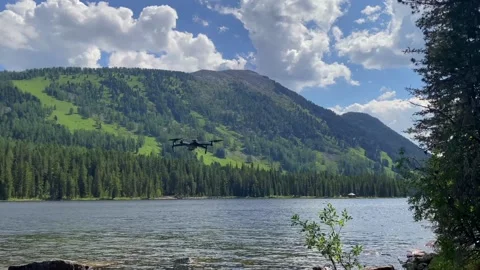 Drone launch over Rakhmanovsky Lake in Katon Karagai 動画素材 316881692