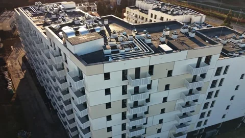 Drone Left Flyover of Modern Apartment Complex with White Balconies | 4K Stock Footage 325446470