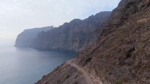 Drone Lift from Ocean Waves to Los Gigantes Cliffs, Tenerife, 4K Stock Footage 314735295