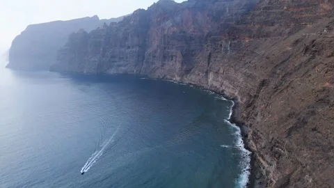 Drone Lift from Ocean Waves to Los Gigantes Cliffs, Tenerife, 4K Stock Footage 314735315