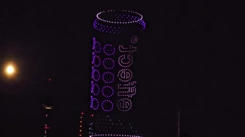 Drone Light Show: Beverage Can with "effect." Branding Near the Moon in the.. Stock Footage 341599570
