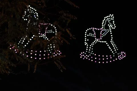 Drone Light Show Creating a Rocking Horse Silhouette Stock Photos